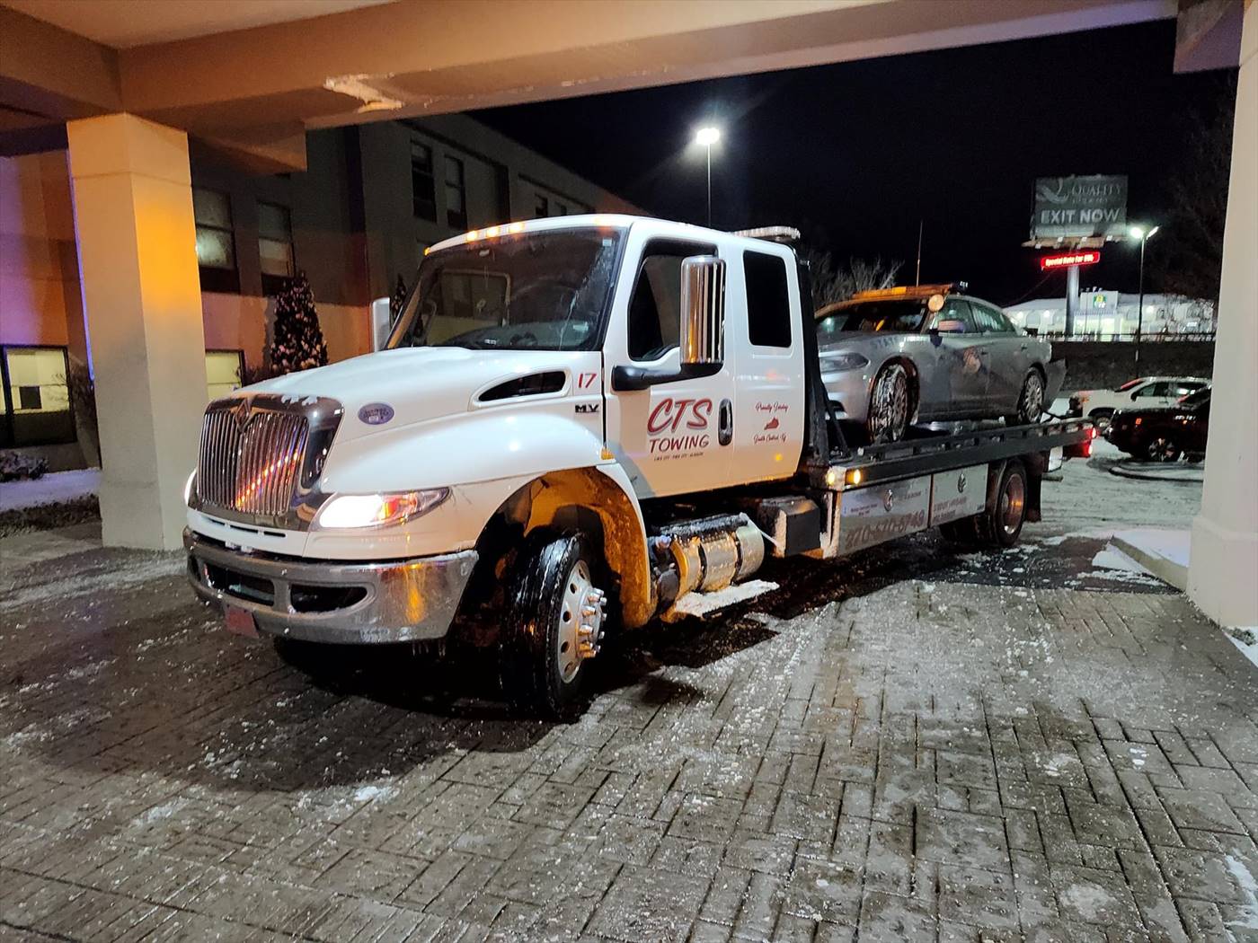 light towing truck towing car