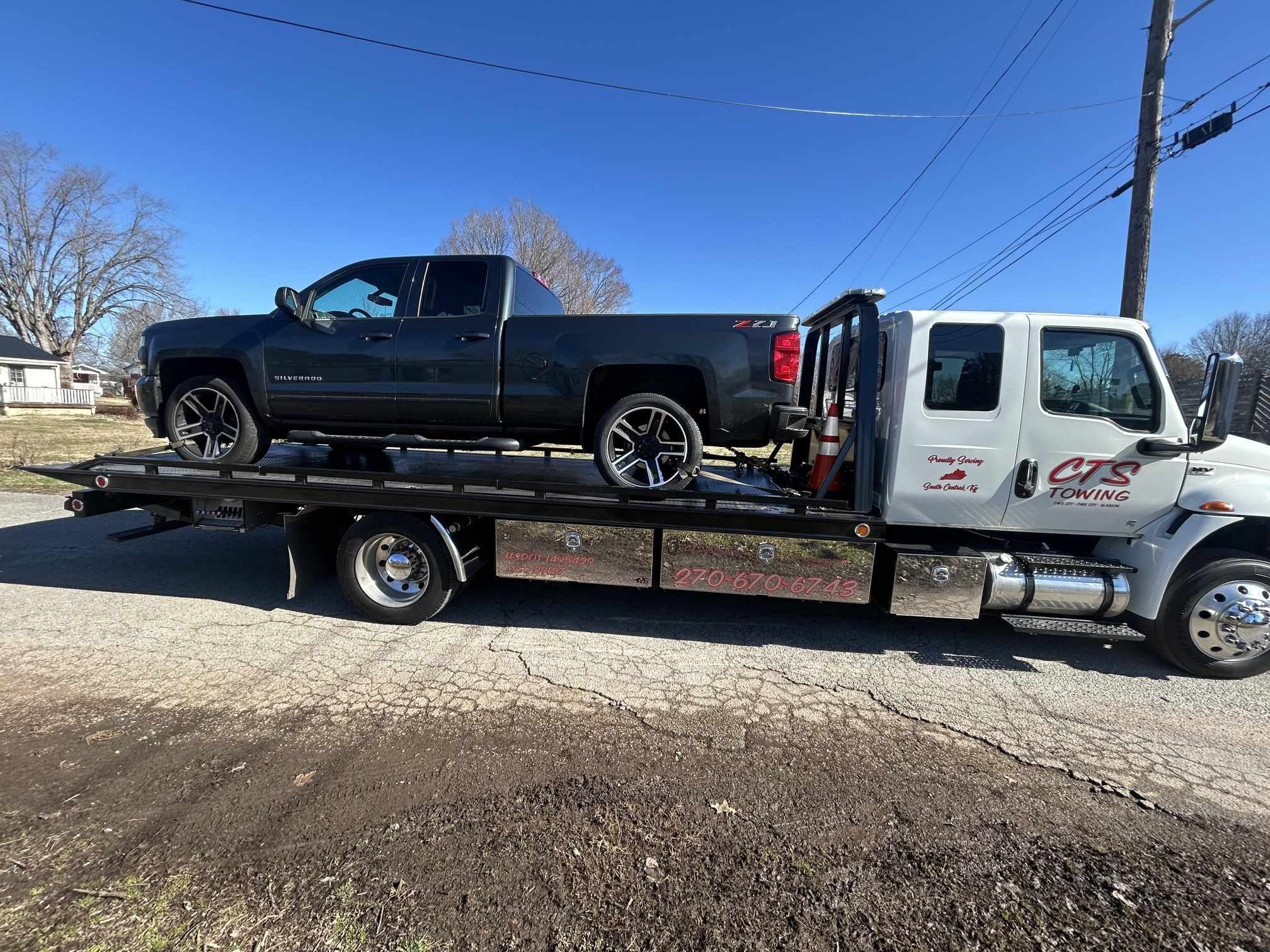 hauling black pickup truck
