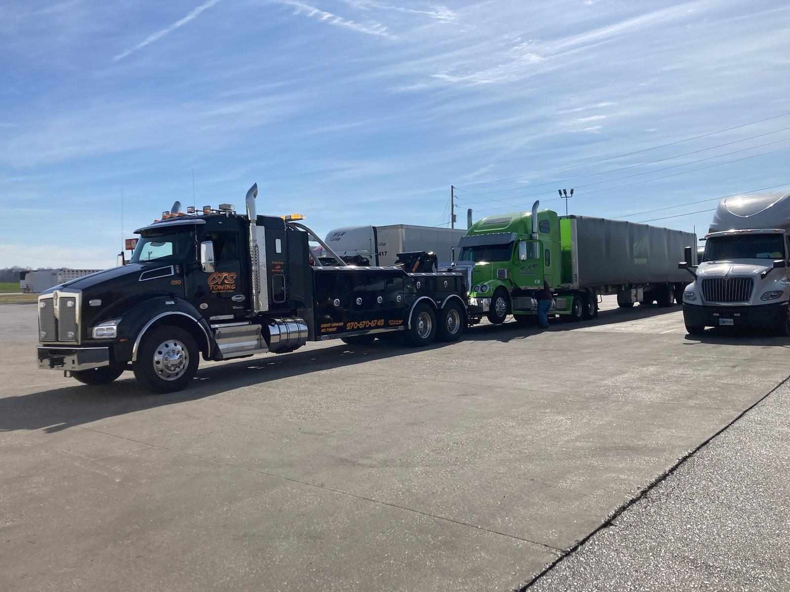 pulling green semi truck