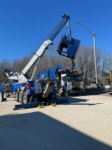 crane tow truck lifting heavy machinery